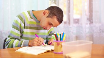 young adult man engages in self study, in rehabilitation center